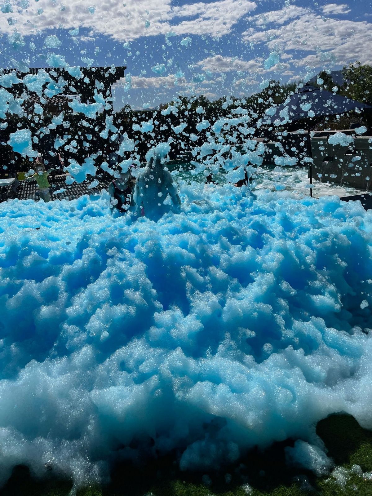 Colorful foam party setup with blue foam