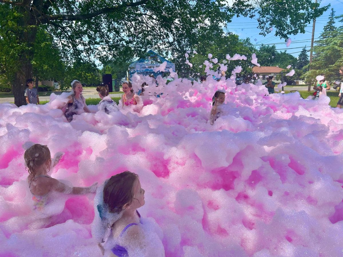 Kids enjoying a bright foam party with the VRcade team